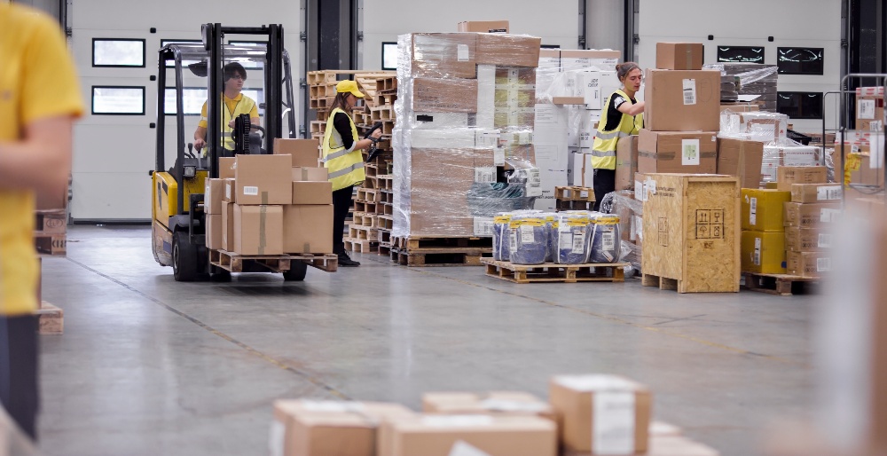 Deskless employees doing audits in a warehouse