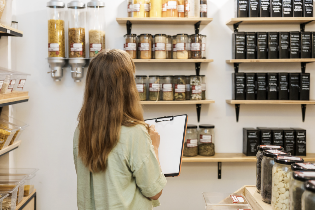 store manager counting retail store inventory